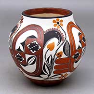 A polychrome replica of a pot from about 1900 with a four panel bird, flower and geometric design
 by Lilly M Salvador of Acoma