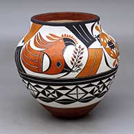 A polychrome jar decorated with a parrot, flower, rainbow, rain cloud and geometric design
 by Lilly M Salvador of Acoma