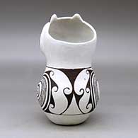A polychrome owl figure decorated with a fineline, spiral and geometric design, click or tap to see a larger version