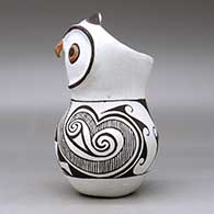 A polychrome owl figure decorated with a fineline, spiral and geometric design, click or tap to see a larger version
