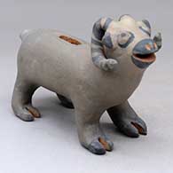 A polychrome bighorn ram coin bank
 by Unknown of Cochiti
