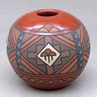 A polychrome jar decorated with a four-panel rain cloud and geometric design
 by Minnie Vigil of Santa Clara