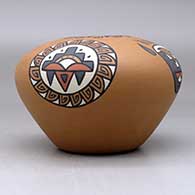 A polychrome jar decorated with a four-panel bear paw, rain cloud and geometric design, click or tap to see a larger version