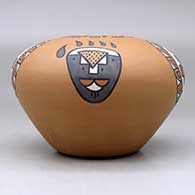 A polychrome jar decorated with a four-panel bear paw, rain cloud and geometric design, click or tap to see a larger version