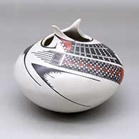 A polychrome jar with an organic opening and decorated with a two panel checkerboard and geometric design
 by Mireya Quezada of Mata Ortiz and Casas Grandes