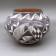 Polychrome jar with a traditional Acoma design featuring checkerboard, fine line, and geometric elements
 by Unknown of Acoma