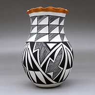 A polychrome vase with a pie crust rim and decorated with a four-panel geometric design, click or tap to see a larger version