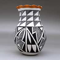 A polychrome vase with a pie crust rim and decorated with a four-panel geometric design, click or tap to see a larger version