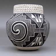 A black on white jar decorated with a three-panel Tularosa spiral, fineline, kiva step and geometric design, plus a band of corrugation around the neck, click or tap to see a larger version