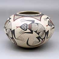 A polychrome jar decorated with a five-panel lizard and geometric design
 by Roberto Banuelos of Mata Ortiz and Casas Grandes