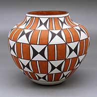 A polychrome jar decorated with a stylized checkerboard and geometric design
 by Marie Juanico of Acoma