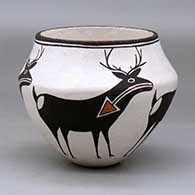 A polychrome jar with a recurved neck and decorated with a four panel deer-with-heart-line design
 by Lucy Lewis of Acoma