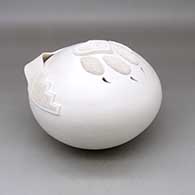 A white seed pot decorated with an applique ribbon and bear paw with cutouts for the claws, click or tap to see a larger version