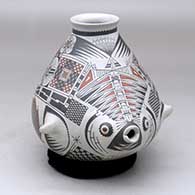 Click for a larger view A polychrome fish effigy jar decorated with a geometric design
by Jose Quezada of Mata Ortiz and Casas Grandes