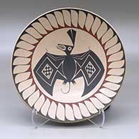A shallow Ramos polychrome bowl decorated with a bat and geometric design
 by Sabino Villalba of Mata Ortiz and Casas Grandes