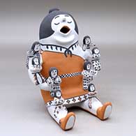 A sitting grandmother storyteller figure with eight children
 by Martha Arquero of Cochiti