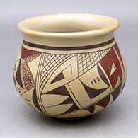 A polychrome bowl with a flared rim and decorated with a four panel bird element and geometric design around the body
 by Bonnie Sahmie of Hopi