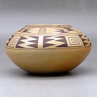 A black on brown jar decorated with a geometric design above the shoulder and fire clouds, click or tap to see a larger version