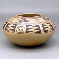 A black on brown jar decorated with a geometric design above the shoulder and fire clouds
 by James Nampeyo of Hopi