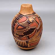 Click for a larger view A polychrome jar decorated with a carved, sgraffito and painted two-panel duck, feather and geometric design
 by Thomas Polacca of Hopi