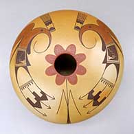 A polychrome seed pot decorated above the shoulder with a thunderbird, flower and geometric design
 by Jacob Koopee of Hopi