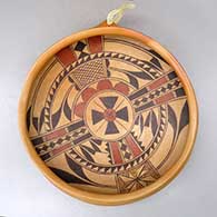An open polychrome wall hanging bowl with a flared rim and decorated inside with a four panel bird element and geometric design
 by Rachel Sahmie of Hopi