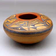 A polychrome seed pot decorated with a four panel sherd and geometric design above the shoulder
 by Rondina Huma of Hopi