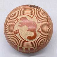 A miniature polychrome seed pot decorated with a sgraffito and painted squirrel, feather and geometric design
 by Glendora Fragua of Jemez