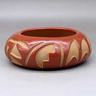 A red bowl carved with a two-panel geometric design around the body
 by Madeline Tafoya of Santa Clara