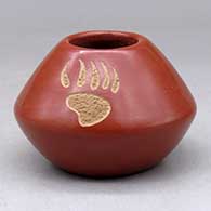 A small red jar decorated above the shoulder with a three panel sgraffito bear paw design
 by Goldenrod of Santa Clara