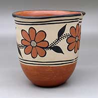 A polychrome bowl with a flared lip and decorated with a band of flower, leaf and vine design around the body
 by Santana Melchor of Santo Domingo