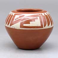 A buff on red jar decorated with a two-panel feather and geometric design
 by Helen Gutierrez of San Ildefonso