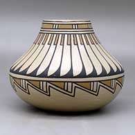 A polychrome low shouldered jar  decorated with a feather and geometric design, click or tap to see a larger version