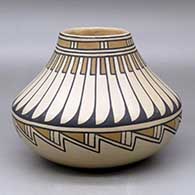 A polychrome low shouldered jar  decorated with a feather and geometric design
 by Blue Corn of San Ildefonso
