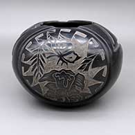Black jar with a carved and sgraffito butterfly, hummingbird, flower, leaf, feather ring, and geometric design
 by Gwen Tafoya of Santa Clara