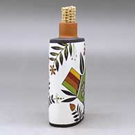 A polychrome flask with a corn cob stopper and decorated with a parrot, plant and geometric design, click or tap to see a larger version