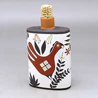A polychrome flask with a corn cob stopper and decorated with a parrot, plant and geometric design
 by Charmae Natseway of Acoma