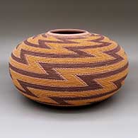 A polychrome tiny-coil jar decorated with a sgraffito and painted lightning bolt design around nearly the entire pot
 by Richard Zane Smith of Wyandot