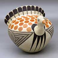 A polychrome turkey effigy pot decorated with a bird element, fineline, and geometric design
 by Anita Lowden of Acoma
