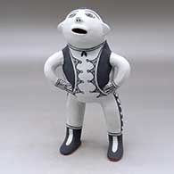 A standing male opera singer figure
 by Martha Arquero of Cochiti