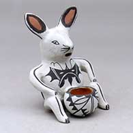 Click for a larger view A polychrome seated rabbit figure with a pot between its legs, decorated with a geometric design
by Martha Arquero of Cochiti