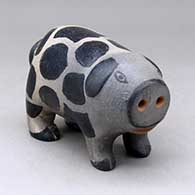 A polychrome pig figure
 by Frances Suina of Cochiti