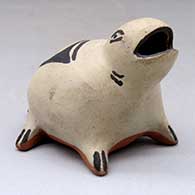A polychrome animal figure with a geometric design on its back
 by Frances Herrera of Cochiti