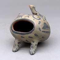 A polychrome open mouthed frog figure with a lizard applique on its back
 by Unknown of Cochiti