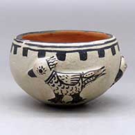 A polychrome bowl decorated around the body with three bird appliques and a geometric design
 by Unknown of Cochiti