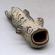 A polychrome five-finned, two-legged fish figure
 by Unknown of Cochiti