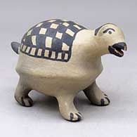 A polychrome animal figure with a checkerboard blanket on its back
 by Damacia Cordero of Cochiti