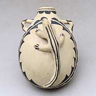 A polychrome canteen with handles, a lizard applique and a geometric design
 by Unknown of Cochiti