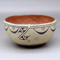 A polychrome bowl polished inside and decorated around the outside with a geometric design
 by Unknown of Cochiti