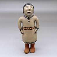 A standing polychrome singing woman figure
 by Unknown of Cochiti